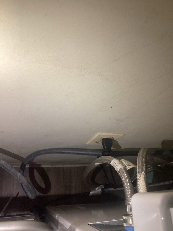 Conducted electrical inspection of premises, including testing of electrical components with diagnostic equipment and examination of junction box installations near plumbing/HVAC connections. Photographic documentation was taken of testing equipment readings and utility installation areas for record-keeping purposes.
