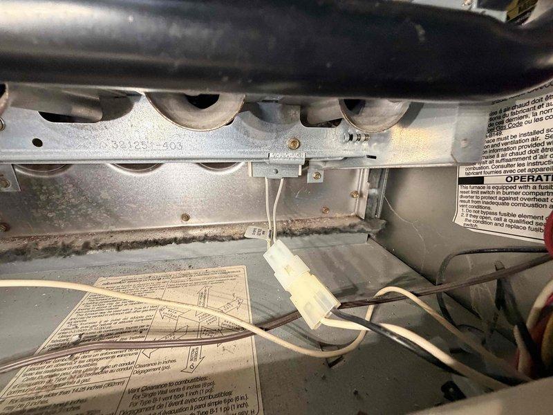 Performed monthly heating maintenance service on HVAC system. Inspected burner assembly and heat exchanger, noting normal dust accumulation but confirming proper flame characteristics and operation. System is functioning correctly with all electrical connections secure.