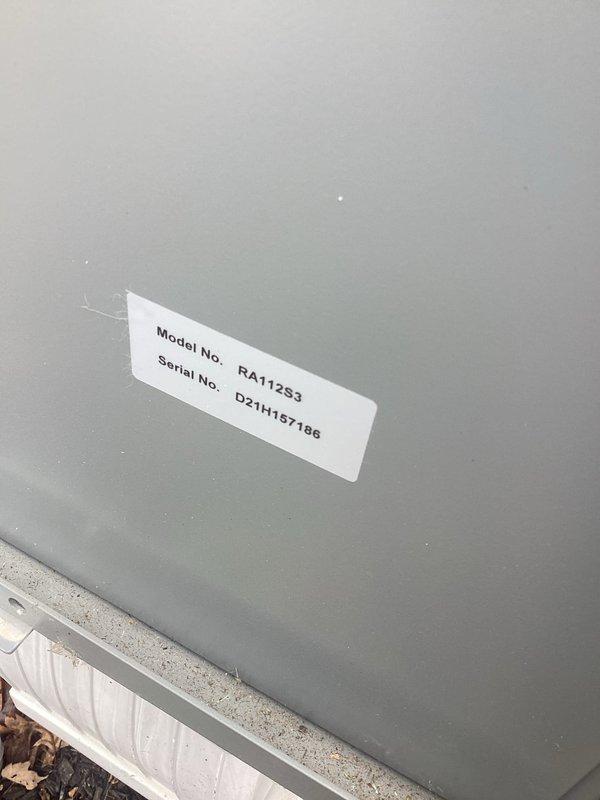 Conducted site assessment for EV charger installation, including evaluation of existing electrical panel capacity and load calculations. Panel inspection revealed an older service panel with limited available space; documented model RA1123 (serial D21H1157196) for compatibility verification with proposed charging equipment.