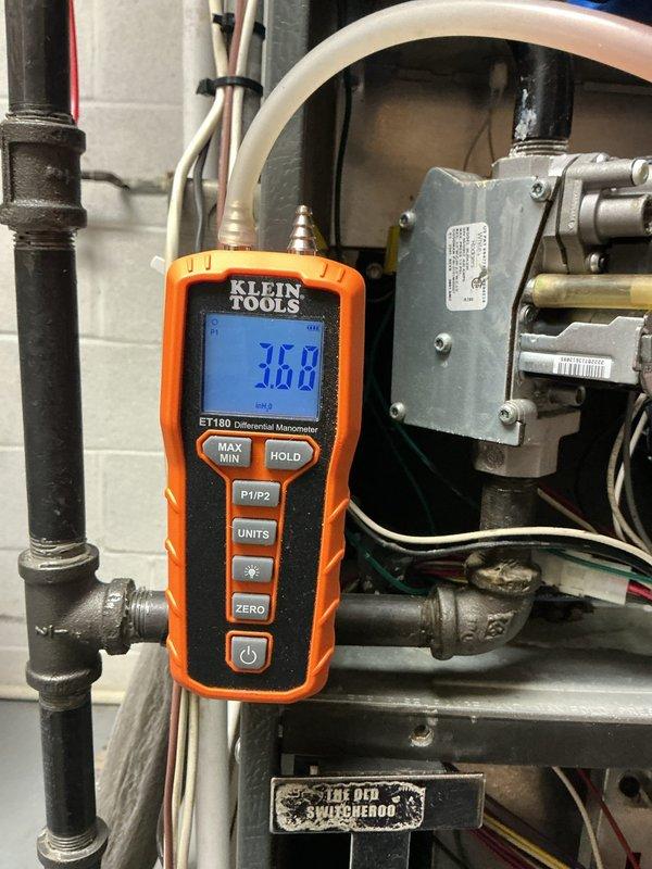 Performed scheduled heating maintenance on dual-system installation. Conducted gas pressure testing with digital manometer, recording static pressure of 3.06. Inspected furnace components, filter condition, and PVC venting system for proper operation and safety compliance.