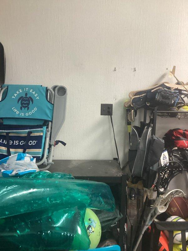 Conducted a site assessment for EV charger installation. Inspected the garage wall location and evaluated the existing electrical panel to determine capacity for additional load. Noted the panel has multiple circuits but would require modifications to accommodate a dedicated 240V circuit for the charging station.