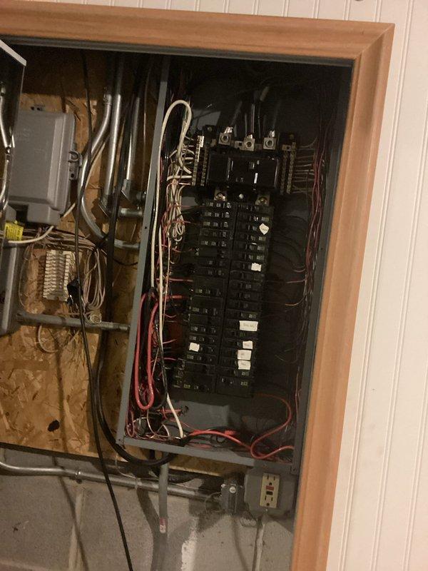 Conducted a site assessment for EV charger installation. Inspected the garage wall location and evaluated the existing electrical panel to determine capacity for additional load. Noted the panel has multiple circuits but would require modifications to accommodate a dedicated 240V circuit for the charging station.
