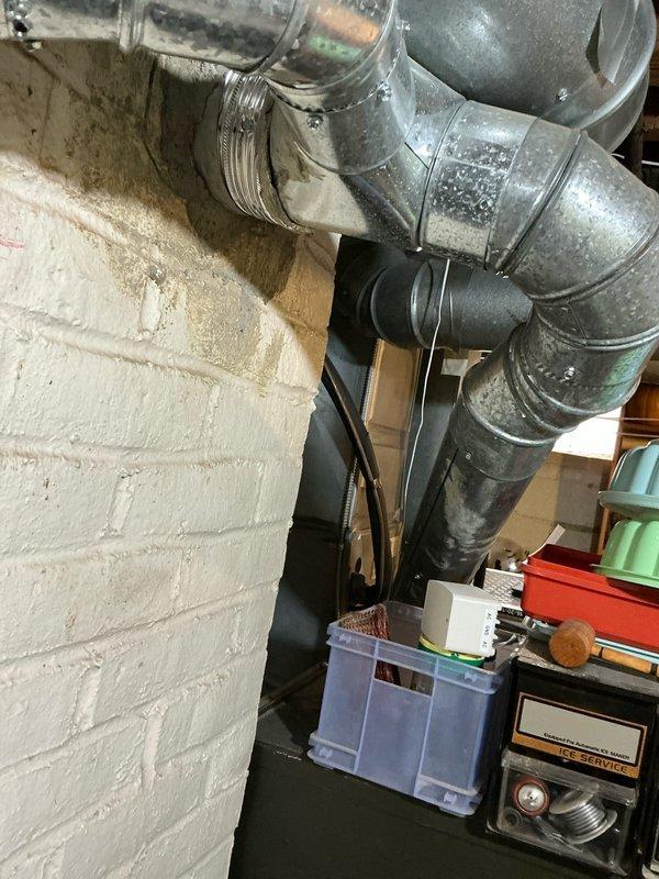 Conducted site inspection to evaluate generator installation options and assess dehumidification needs for the property. Examined existing HVAC ductwork system, noting dust accumulation and wear on sheet metal components. Documented current setup with special attention to available space constraints and potential integration points for proposed equipment.
