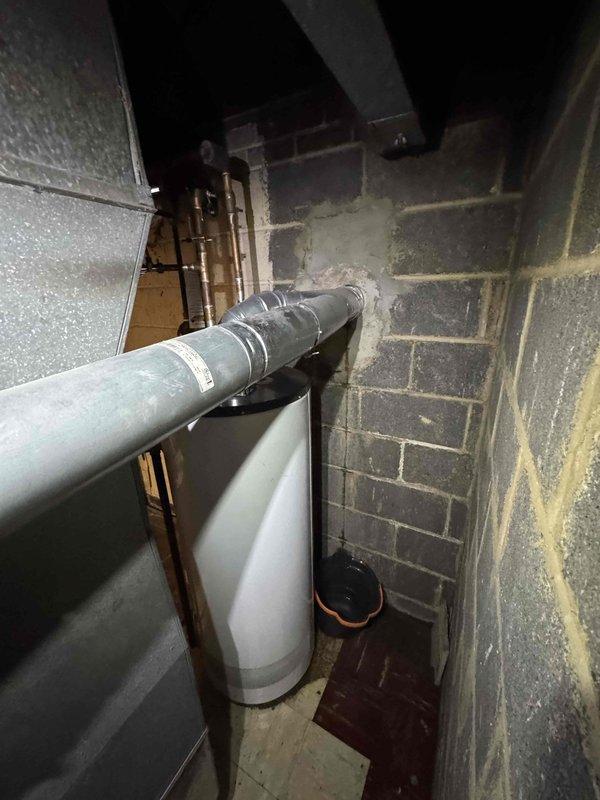 Responded to no heat call where customer reported water on and around furnace. Visual inspection of HVAC system revealed condensation/moisture on metal components and electrical connections. Identified water intrusion from nearby plumbing (PVC pipe with compromised joints/insulation) in utility area affecting furnace operation. Dried affected components and recommended proper sealing of plumbing connections to prevent future water damage to heating system.