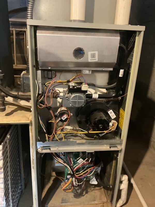 Completed biannual maintenance service on two residential furnace systems. Both units were inspected with front panels removed, revealing clean heat exchangers, properly functioning control boards, and correctly connected wiring. All components were tested for proper operation, filters were replaced, and ventilation systems were verified to be unobstructed.