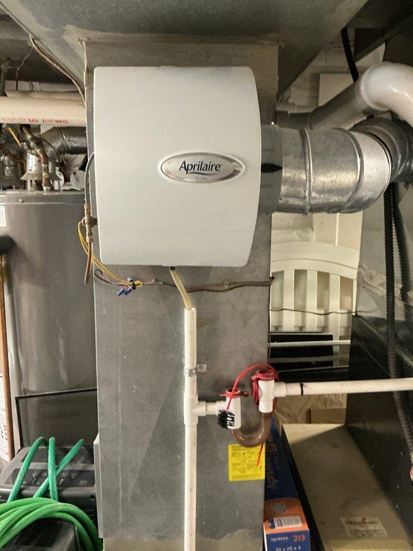 Performed scheduled heating maintenance on residential furnace system. Inspected Aprilaire whole-home humidifier and verified proper connection to ductwork. Checked pressure switches and control modules for proper operation, confirming all electrical connections were secure and functioning correctly.