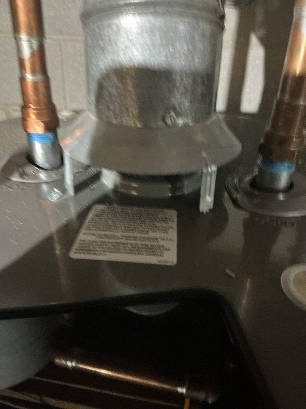 Completed scheduled maintenance on two heating systems. Inspected and serviced a water heater system with connected copper piping and exhaust ventilation, confirming proper installation and operation. Also performed maintenance on an Aprilaire whole-home humidifier unit mounted adjacent to the HVAC system, verifying all components were functioning correctly and properly connected to the ductwork.