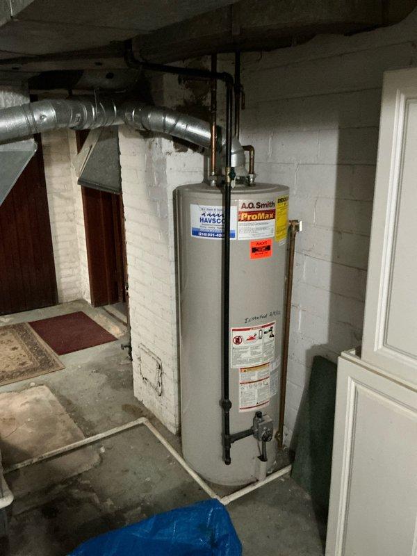 Performed diagnostic assessment on HVAC system, identifying a cracked heat exchanger requiring full system replacement. Documented existing water heater (A.O. Smith ProMax) and inspected deteriorating ductwork with compromised connections and visible wall damage. Presented customer with replacement options for furnace, air conditioner, and water heater.