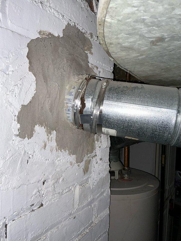 Performed diagnostic assessment on HVAC system, identifying a cracked heat exchanger requiring full system replacement. Documented existing water heater (A.O. Smith ProMax) and inspected deteriorating ductwork with compromised connections and visible wall damage. Presented customer with replacement options for furnace, air conditioner, and water heater.