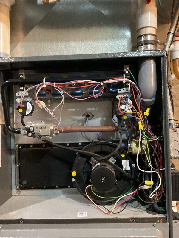 Performed scheduled heating maintenance service on residential gas furnace system. Inspected and tested all internal components including blower motor, electrical connections, and control board. System is functioning properly with no issues identified; all ventilation and condensate lines are properly connected and in good condition.