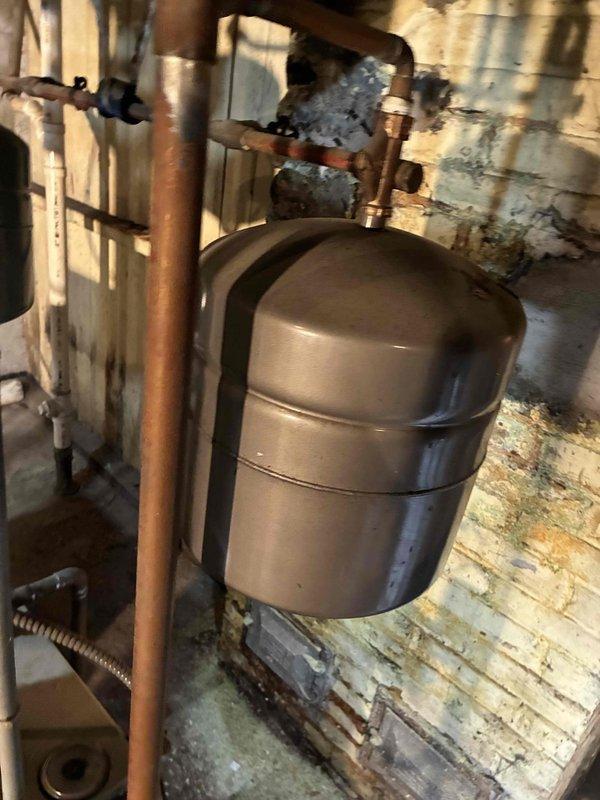 Performed scheduled maintenance on dual boiler system. Checked expansion tank and copper piping for proper operation, noting moderate oxidation but functional condition. Conducted diagnostic testing with digital analyzer, confirming system pressure at 12.2 PSI and all components operating within specifications.
