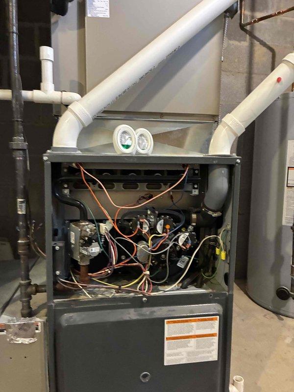 Performed scheduled heating maintenance on residential furnace system. Inspected internal components including control board, wiring connections, and pressure switches, confirming all were in proper working order with no visible damage or wear. Documented system condition with photos for service records.