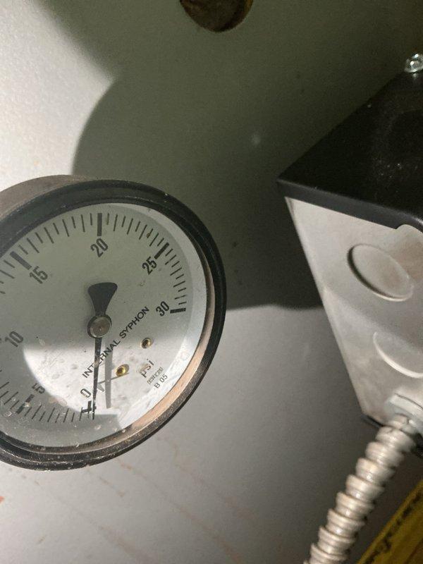 Performed routine heating maintenance service on system. Inspected Honeywell control device and verified proper operation of cut-in switch. System pressure gauge reading at 17-18 PSI, within normal operating parameters for this heating unit.
