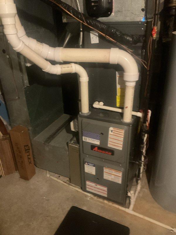Performed scheduled heating maintenance on Amana furnace system. Inspected electrical components, wiring connections, and control board for proper operation. Examined PVC venting system and verified all connections were secure with no visible issues.