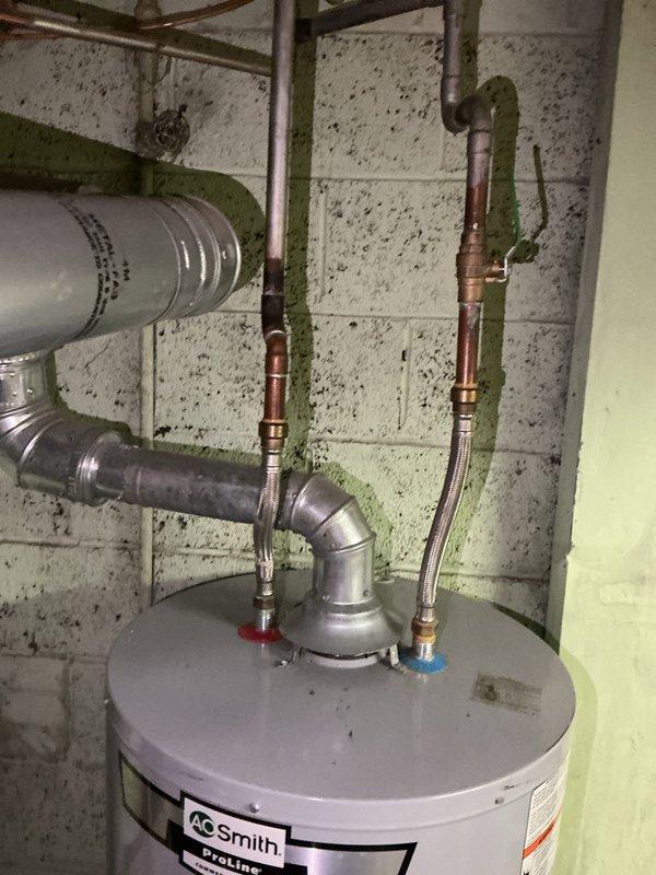 Performed routine heating maintenance on aging system (10+ years old). Inspected heat exchanger for potential deterioration and documented condition with photos. Examined water heater connections, verifying proper function of hot/cold valves and exhaust venting.