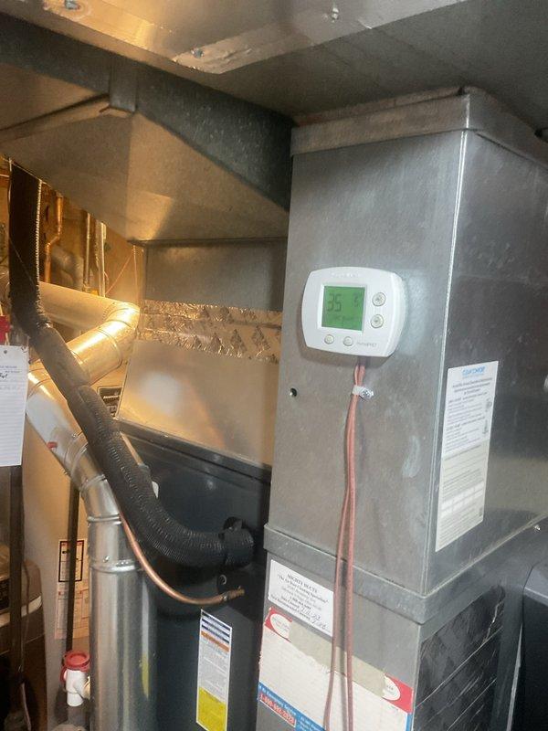 Performed scheduled heating maintenance on system, inspecting electronic control board and verifying proper operation of the air handler. Thermostat was confirmed functional with display reading 35° and all connections secure. System operating within normal parameters with no issues detected.