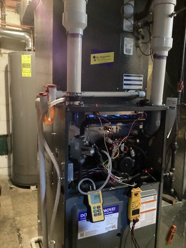 Performed scheduled heating maintenance on customer's furnace system. Conducted thorough inspection of internal components including control board and blower assembly, with diagnostic testing showing readings of 394 on electronic components. Verified proper operation of fan wheel assembly with all blades intact and functioning correctly.