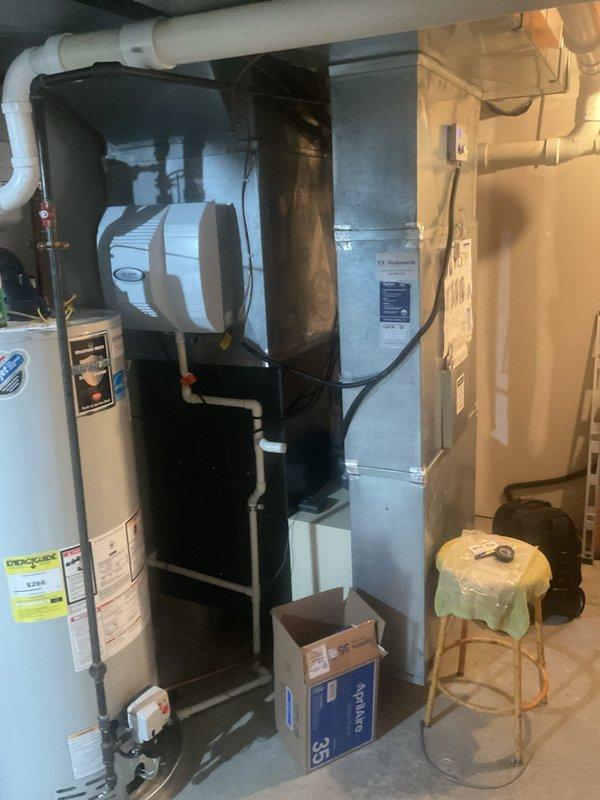Performed routine heating maintenance on residential HVAC system, including inspection of furnace unit with PVC venting and adjacent air handler. System was found to be in proper working condition with no issues identified during the service visit.