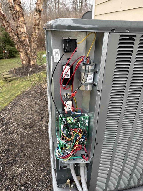 Inspected outdoor HVAC unit following customer complaint of no cooling after previous service. Examined electrical components including circuit board and capacitors. Checked and reattached molnex connector that had been removed during prior service, restoring proper system operation and cooling function.