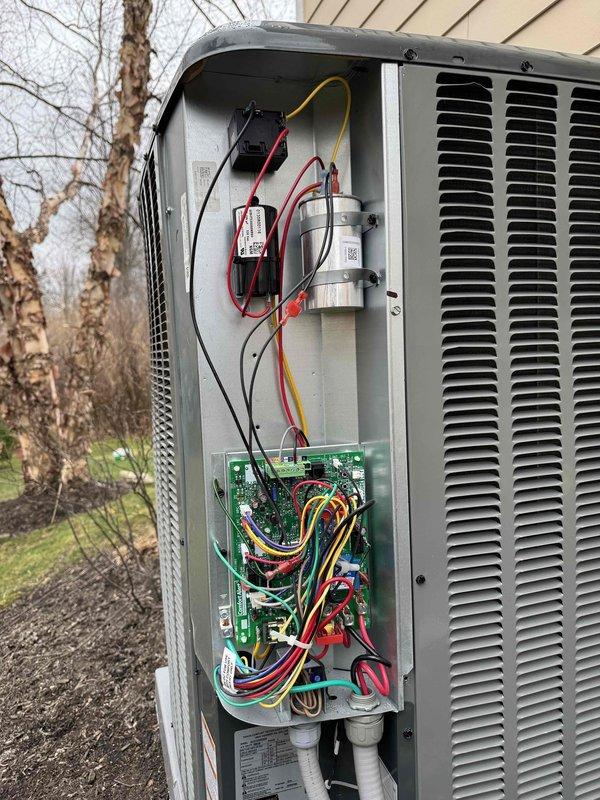 Inspected outdoor HVAC unit following customer complaint of no cooling after previous service. Examined electrical components including circuit board and capacitors. Checked and reattached molnex connector that had been removed during prior service, restoring proper system operation and cooling function.