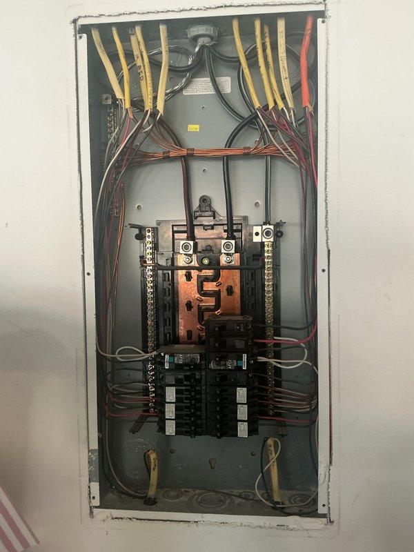 Conducted comprehensive electrical inspection of residential service panel and exterior meter installation. Panel inspection revealed copper bus bar with oxidation and aging wiring, while exterior dual-meter setup and associated junction box were examined for proper installation and function. Photo documentation was completed for both panel interior and service entrance components.