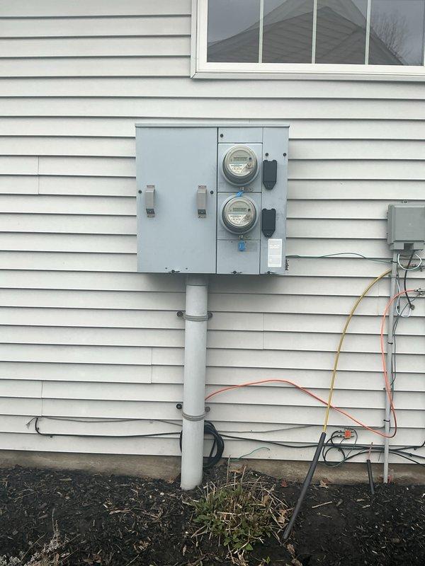 Conducted comprehensive electrical inspection of residential service panel and exterior meter installation. Panel inspection revealed copper bus bar with oxidation and aging wiring, while exterior dual-meter setup and associated junction box were examined for proper installation and function. Photo documentation was completed for both panel interior and service entrance components.