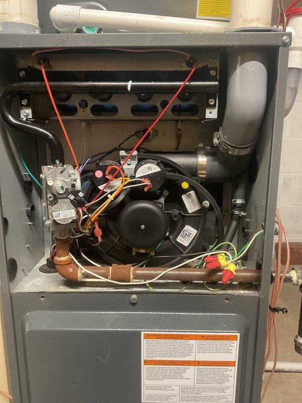 Performed scheduled heating maintenance service on residential furnace. Inspected blower motor assembly, electrical connections, and gas supply components, confirming all systems are operational with no visible damage or abnormal wear. Verified proper function of circuit board and wiring connections throughout the unit.