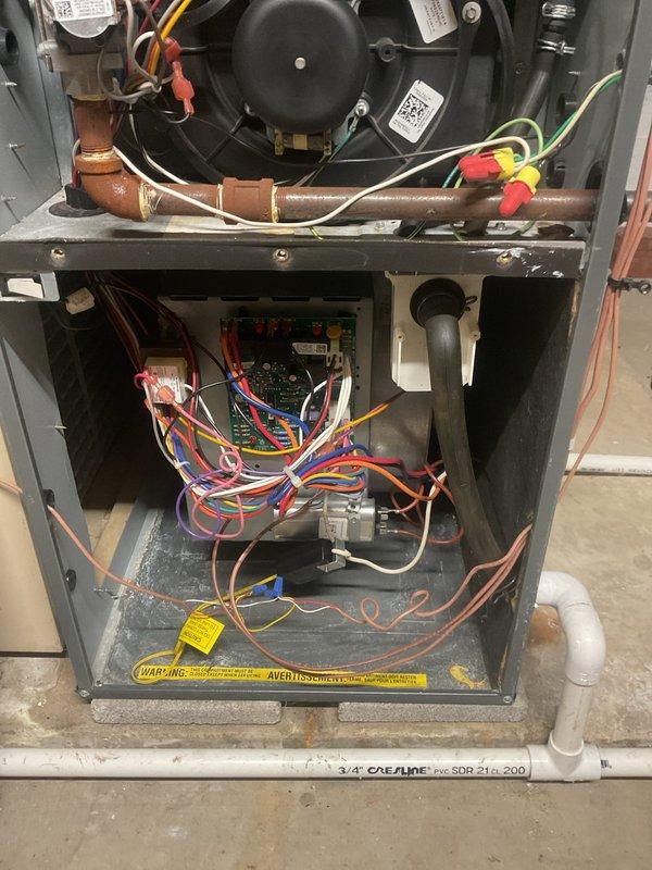 Performed scheduled heating maintenance service on residential furnace. Inspected blower motor assembly, electrical connections, and gas supply components, confirming all systems are operational with no visible damage or abnormal wear. Verified proper function of circuit board and wiring connections throughout the unit.