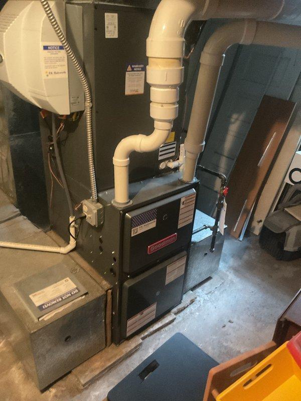 Performed routine maintenance service on Goodman heating system with attached humidifier. Inspected all components including ventilation system, PVC piping, and electrical connections. System functioning properly with no issues identified.