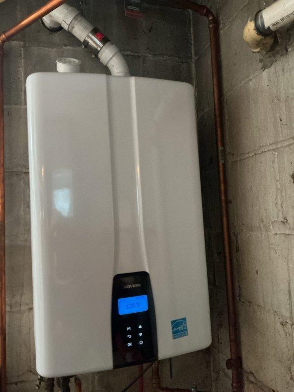 Performed scheduled maintenance on a Navien tanked water heater system. Completed full inspection of internal components including heat exchangers, valves, electrical connections, and circuit board. Verified proper operation of control panel and confirmed Energy Star certified unit is functioning optimally with all plumbing connections secure.