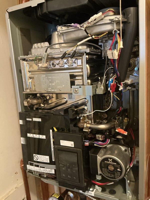 Performed scheduled heating maintenance service on residential furnace system. Inspected copper piping connections, PVC venting, and internal components including wiring harnesses and heat exchanger. Verified proper operation of pump motor, gas valve assembly, and digital control panel while ensuring all electrical connections were secure.