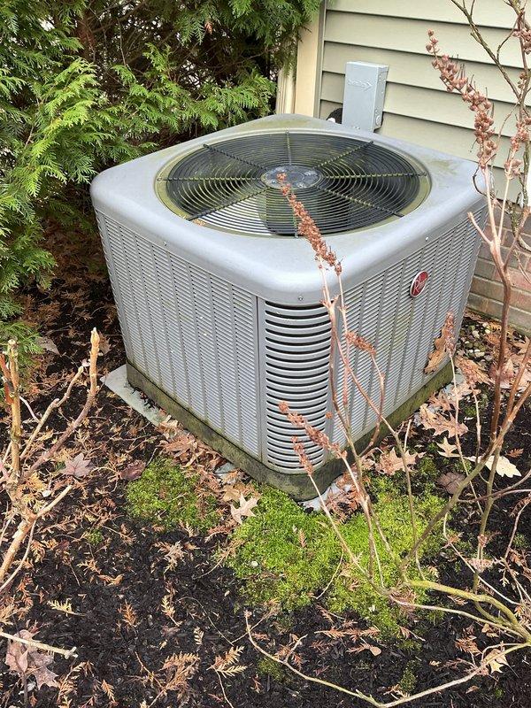 Performed scheduled cooling maintenance on Rheem outdoor AC unit. System was inspected, cleaned, and verified to be operating correctly with the Ecobee thermostat showing proper temperature regulation at 72°F. Unit is properly positioned on concrete pad with adequate clearance despite surrounding vegetation.
