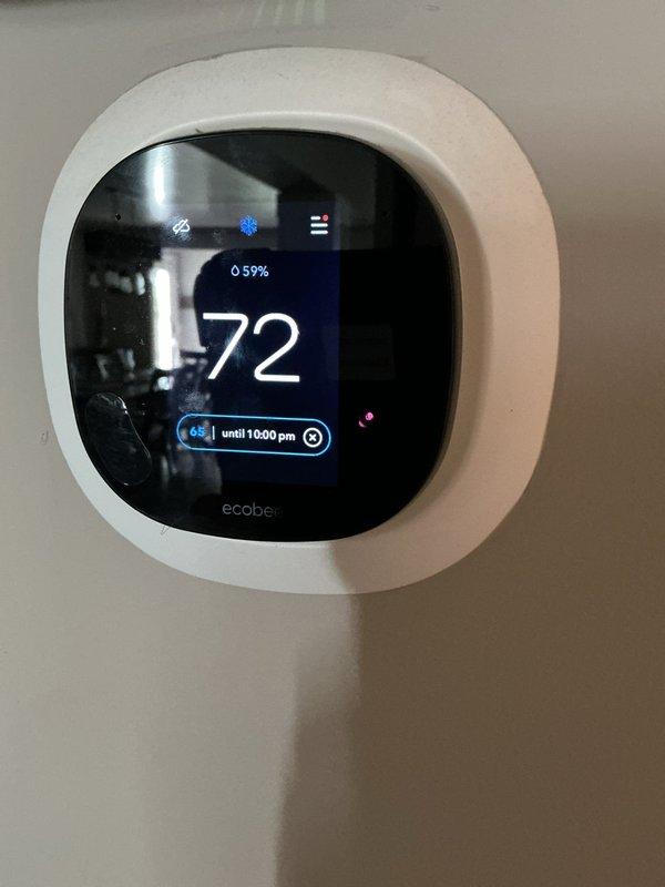 Performed scheduled cooling maintenance on Rheem outdoor AC unit. System was inspected, cleaned, and verified to be operating correctly with the Ecobee thermostat showing proper temperature regulation at 72°F. Unit is properly positioned on concrete pad with adequate clearance despite surrounding vegetation.