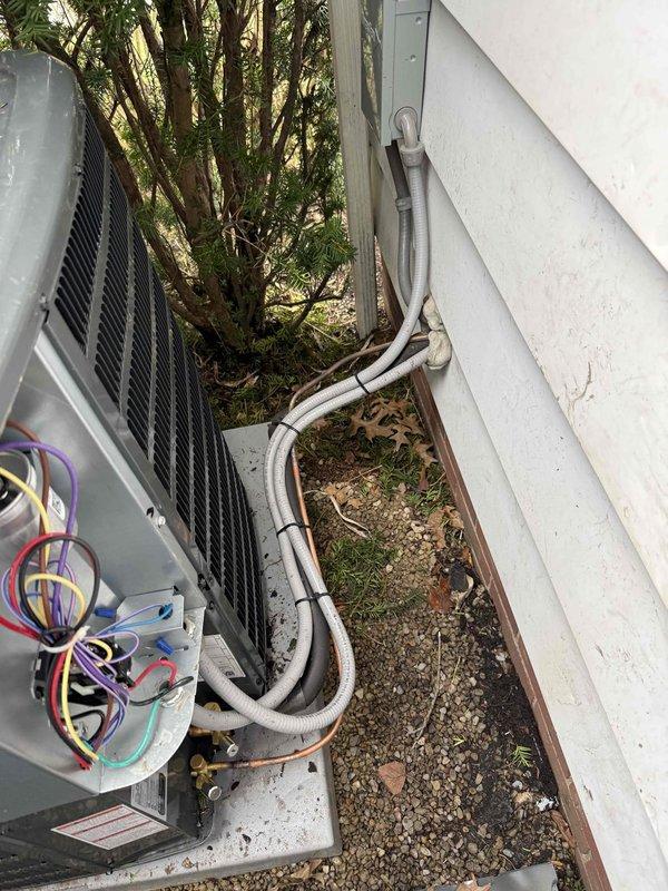 Completed installation of a new 80% efficiency furnace and air conditioning system. The outdoor condenser unit was properly mounted on a concrete pad with secure electrical connections and insulated refrigerant lines. System was financed and all components were tested for optimal performance.