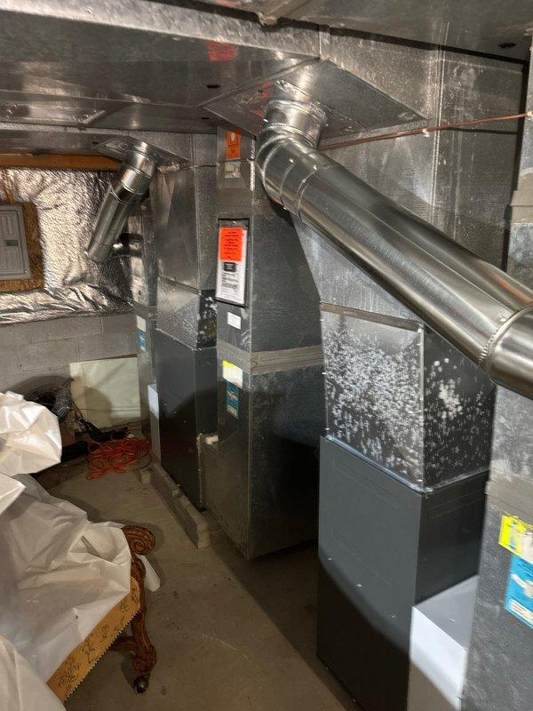 Successfully installed new furnace with dual 2410 humidifiers. Complete installation included proper mounting of Aprilaire humidifier to ductwork with brass water supply valve and connection of galvanized metal ductwork to the central air handler. All components were properly secured with appropriate warning labels applied.