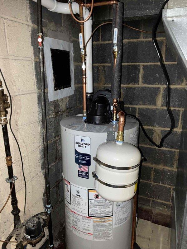 Completed installation of a 96% efficient furnace and 40-gallon Bradford White hot water tank. Installation included proper venting with PVC piping, installation of an expansion tank with appropriate metal strapping, and connection of all necessary copper supply lines with valve controls. All components were tested and verified to be in proper working condition.