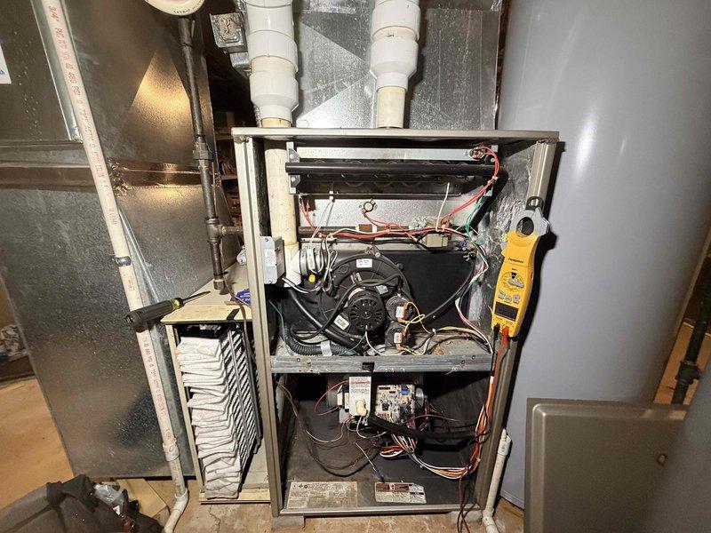 Performed scheduled heating maintenance on two furnace systems. Inspected internal components including electrical connections, wiring integrity, and blower assembly. Evaluated filter condition which showed signs of dust accumulation and examined heat exchanger for possible water staining/discoloration; conducted diagnostic testing with multimeter to verify proper system operation.