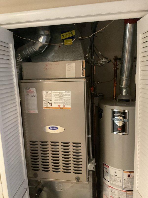Performed scheduled heating maintenance service on Carrier furnace system. Inspected all components including ductwork connections, electrical wiring, and drainage systems. Unit is properly installed alongside Bradford White water heater in utility closet with appropriate ventilation and appears to be operating within normal parameters.