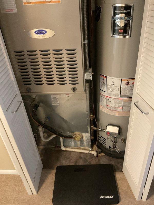 Performed scheduled heating maintenance service on Carrier furnace system. Inspected all components including ductwork connections, electrical wiring, and drainage systems. Unit is properly installed alongside Bradford White water heater in utility closet with appropriate ventilation and appears to be operating within normal parameters.