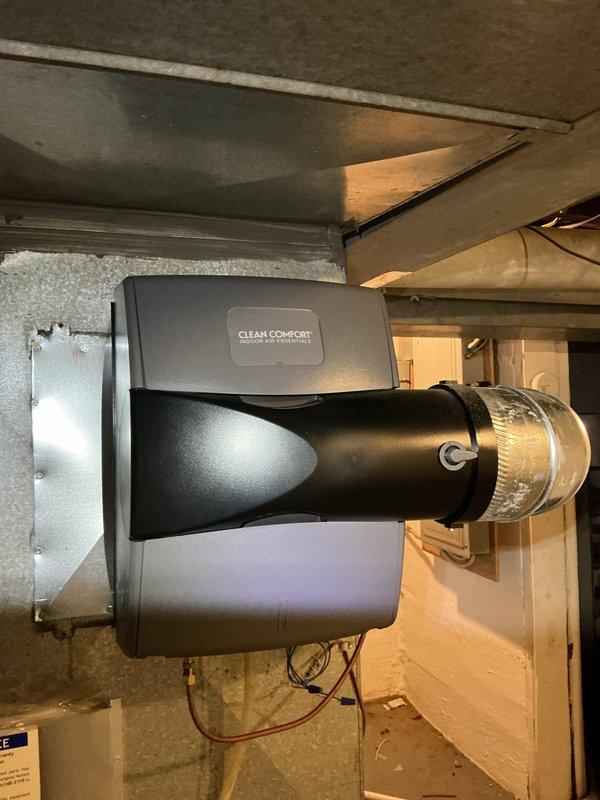 Performed scheduled preventative maintenance on residential furnace system. Inspected Clean Comfort humidifier unit mounted to ductwork and verified proper connection to the HVAC system. Examined furnace with PVC intake/exhaust venting, confirming all connections were secure with appropriate primer at joints.