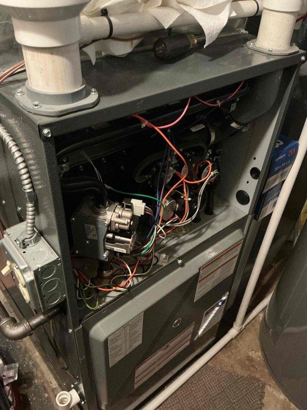 Performed routine heating maintenance on residential HVAC system. Inspected interior components including electrical connections, control board, and blower assembly. All components found in normal working condition with properly organized wiring and no visible damage.