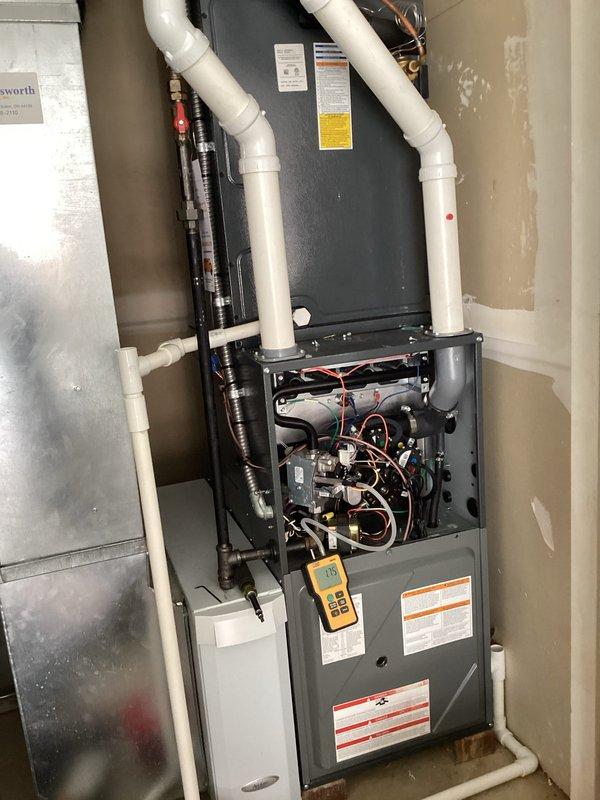 Performed scheduled heating maintenance on residential furnace system. Conducted gas pressure test with UEI manometer showing 1.77" WC reading. Inspected internal components including control board, wiring connections, and ventilation ducts, confirming system is operating within manufacturer specifications.