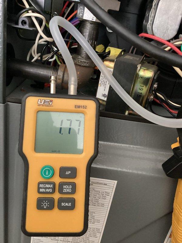 Performed scheduled heating maintenance on residential furnace system. Conducted gas pressure test with UEI manometer showing 1.77" WC reading. Inspected internal components including control board, wiring connections, and ventilation ducts, confirming system is operating within manufacturer specifications.