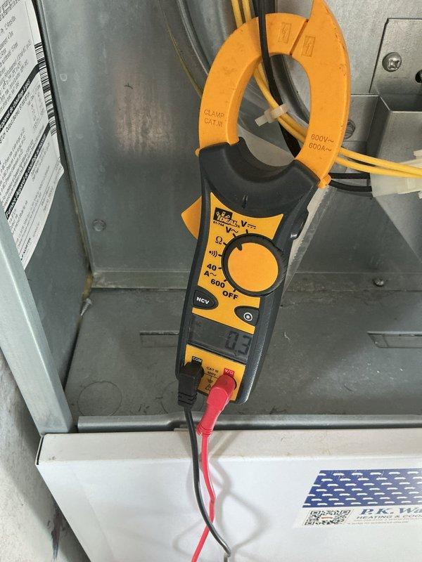 Performed scheduled heating maintenance on system. Conducted electrical amperage testing on components with clamp meter showing readings within normal parameters (0.3A). Inspected gas burner assembly and verified proper flame pattern with characteristic blue center/orange tips, indicating optimal fuel-air mixture and complete combustion.
