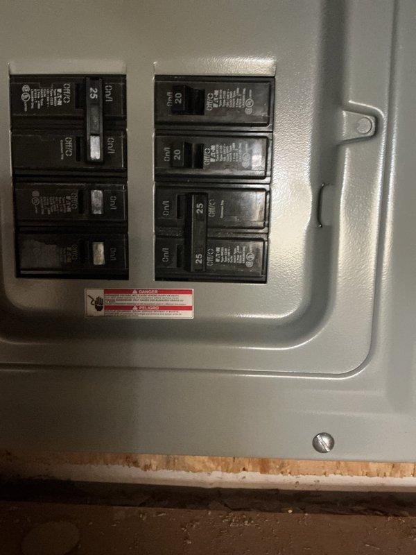 Completed electrical installation service for a previously non-operational circuit. Accessed main breaker panel, installed and properly connected new circuitry with appropriate amperage ratings as documented in photos. Ensured proper routing of conduit and wiring through utility area with PVC piping, verifying all connections meet code requirements.