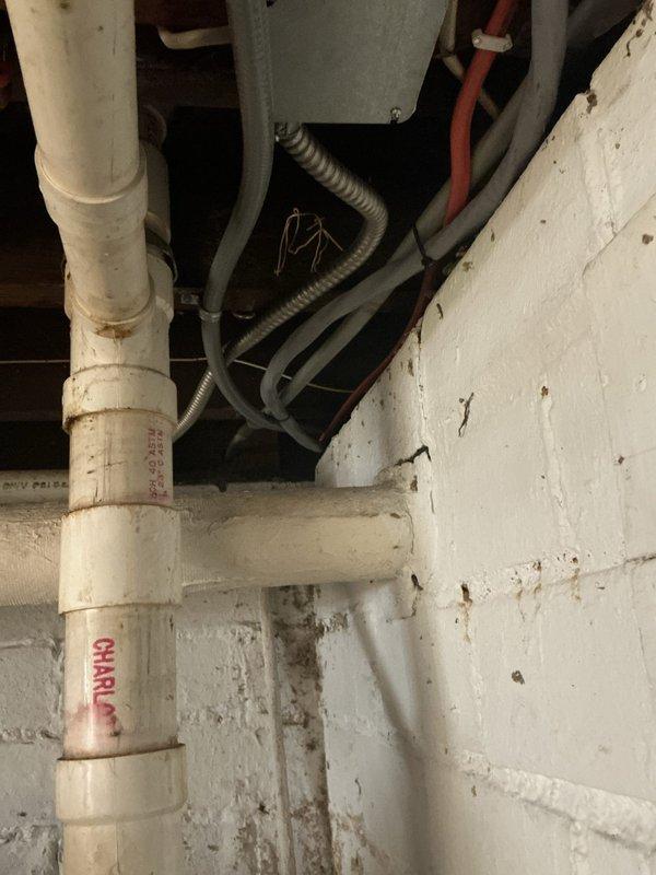 Completed electrical installation service for a previously non-operational circuit. Accessed main breaker panel, installed and properly connected new circuitry with appropriate amperage ratings as documented in photos. Ensured proper routing of conduit and wiring through utility area with PVC piping, verifying all connections meet code requirements.