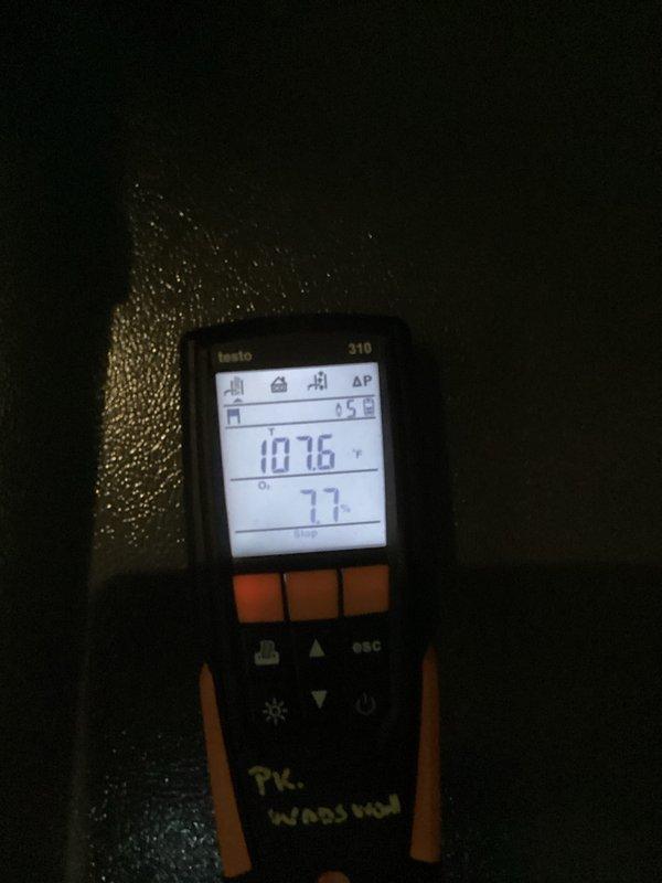 Performed routine heating system maintenance including combustion analysis with Testo 310 digital analyzer showing proper combustion parameters (107.6°/7.7%). Electrical testing with multimeter confirmed nominal voltage readings (0.20/0.61) across control circuits. System is operating within manufacturer specifications.