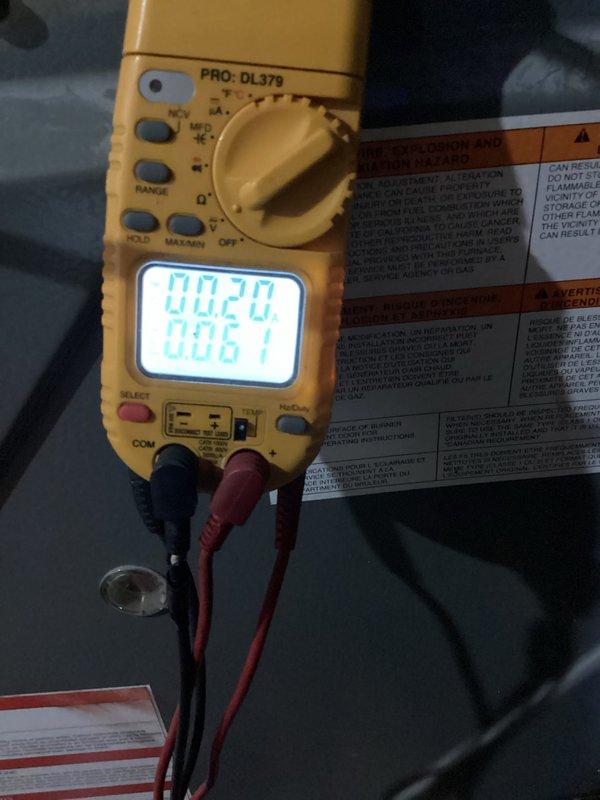 Performed routine heating system maintenance including combustion analysis with Testo 310 digital analyzer showing proper combustion parameters (107.6°/7.7%). Electrical testing with multimeter confirmed nominal voltage readings (0.20/0.61) across control circuits. System is operating within manufacturer specifications.