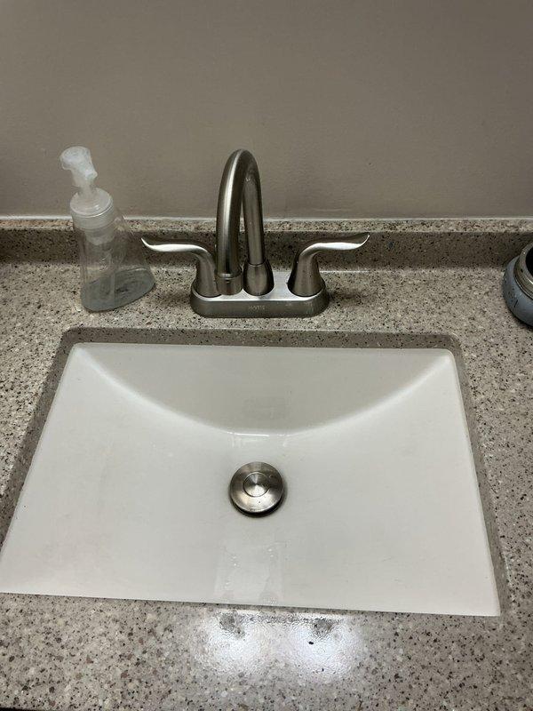 Completed afternoon plumbing inspection of bathroom sink installation, including undermount porcelain basin with brushed nickel faucet. Performed water pressure testing using Watts gauge, with readings measuring approximately 80-90 PSI. All fixtures and connections were verified to be functioning properly with no leaks detected.