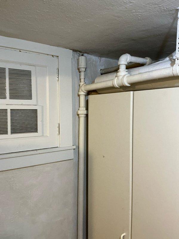 Conducted assessment of existing boiler system and presented repair options to client. Inspected galvanized ductwork in utility area, noting connection points requiring attention. Examined PVC plumbing configuration and ventilation components to determine optimal heating solution.